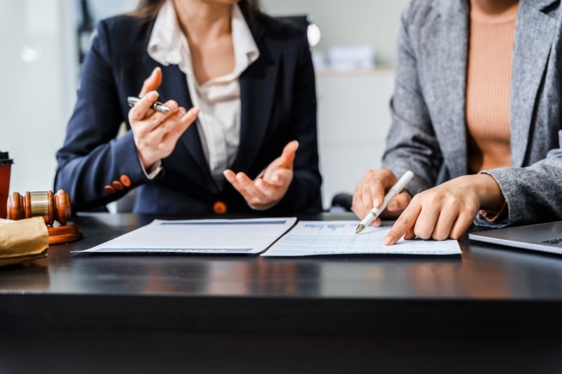 Legal professional reviewing commercial property documents as part of due diligence process